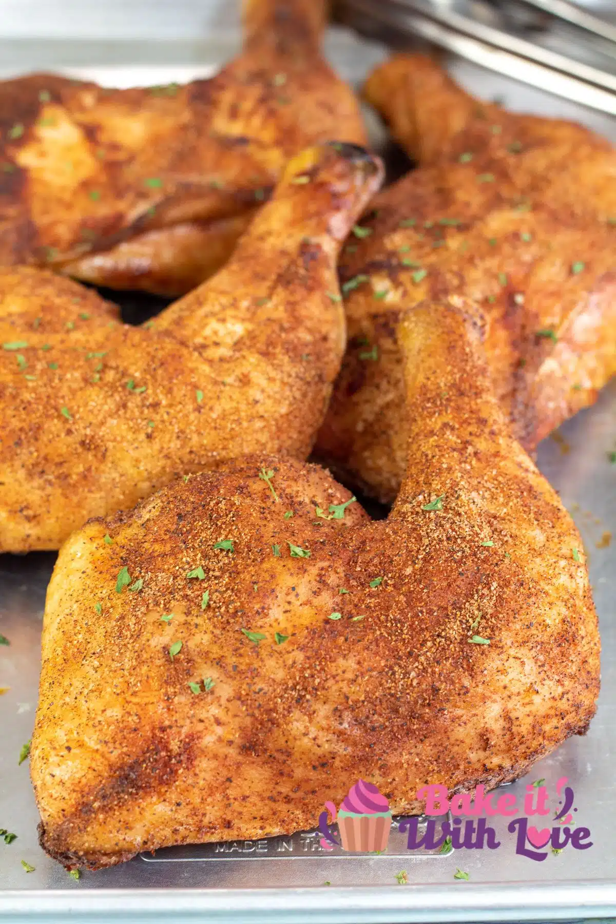 Tall image showing smoked chicken leg quarters.