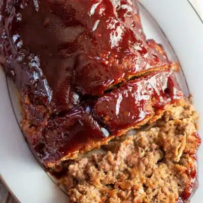 How to freeze meatloaf guide featuring sliced meatloaf with tasty BBQ sauce topping.