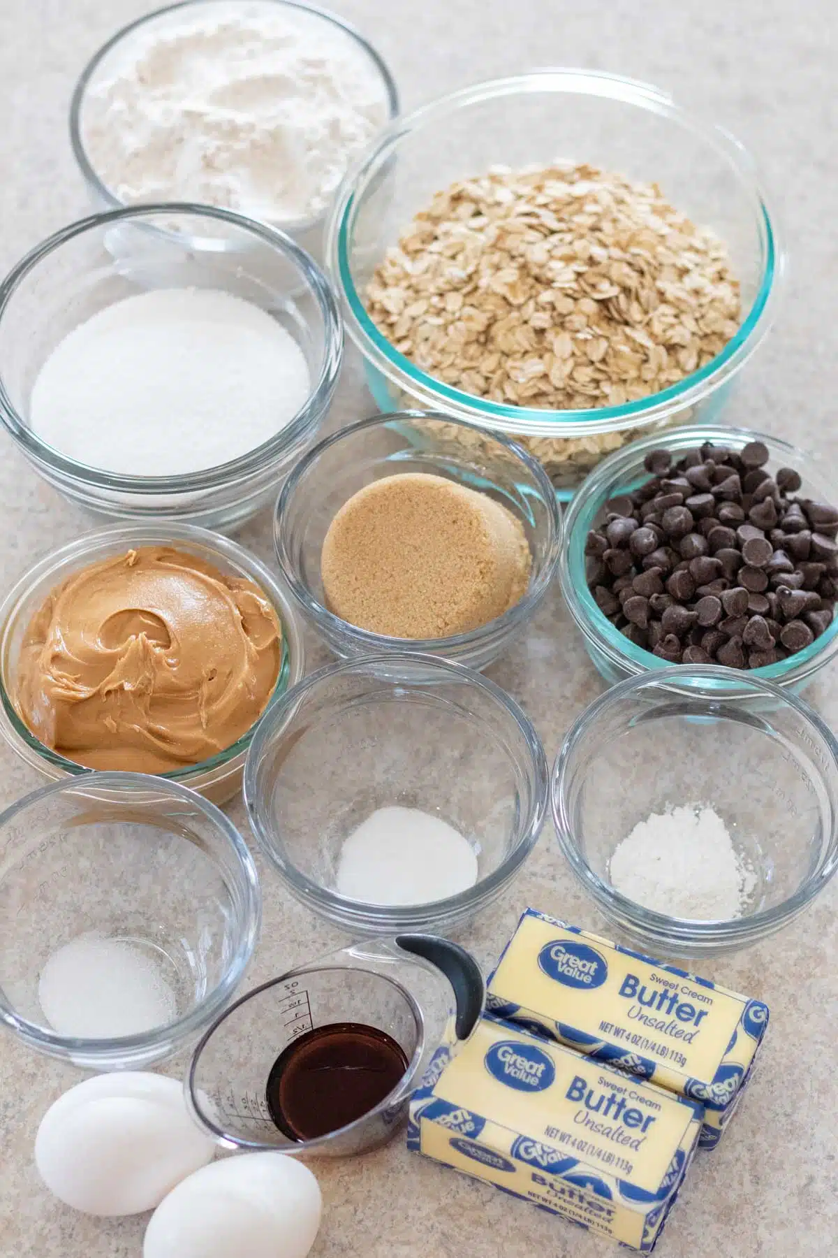 Tall image of peanut butter chocolate chip oatmeal cookie ingredients.