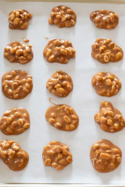 Process image 6 showing portioned peanut candy on a baking sheet.