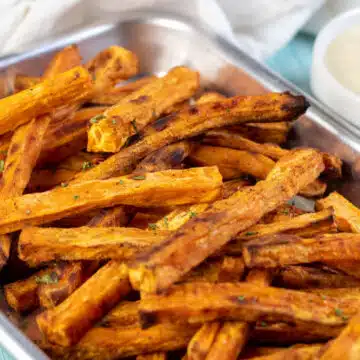 Wide image showing sweet potato fries.