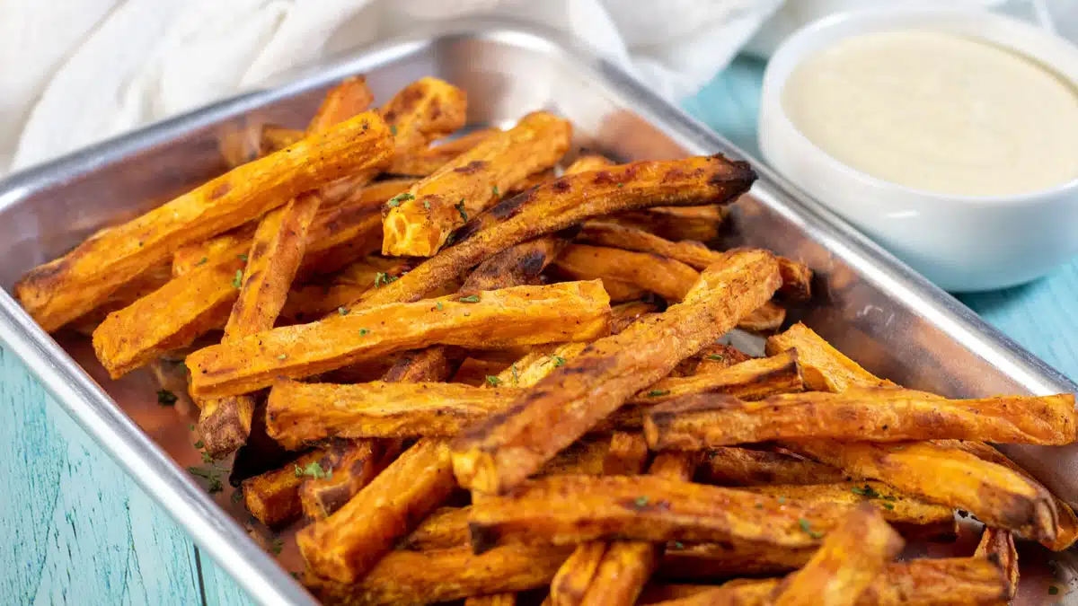 Wide image showing sweet potato fries.