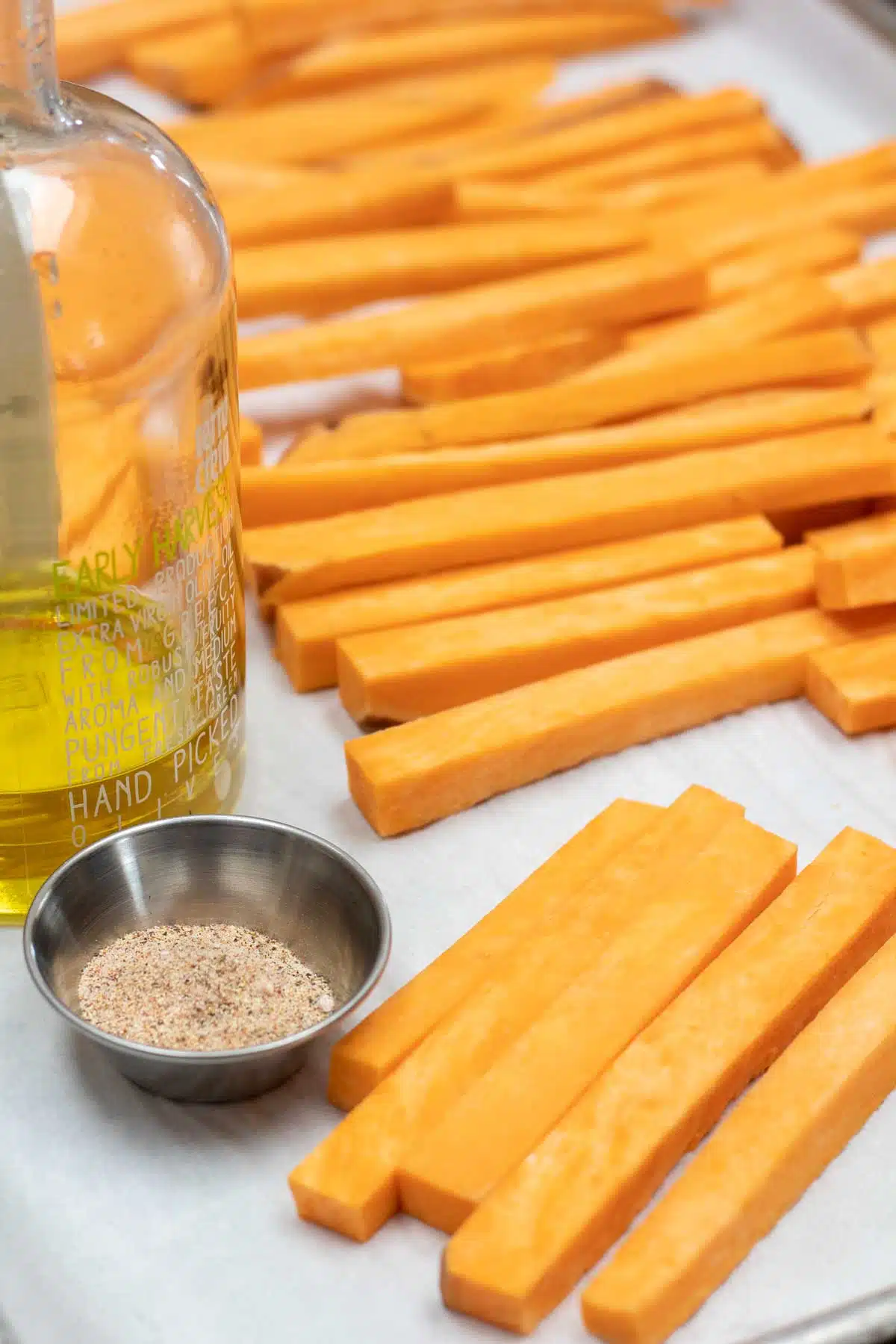 Tall image showing ingredients for sweet potato fries.