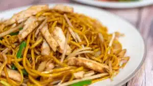 Wide image of chicken chow mein.