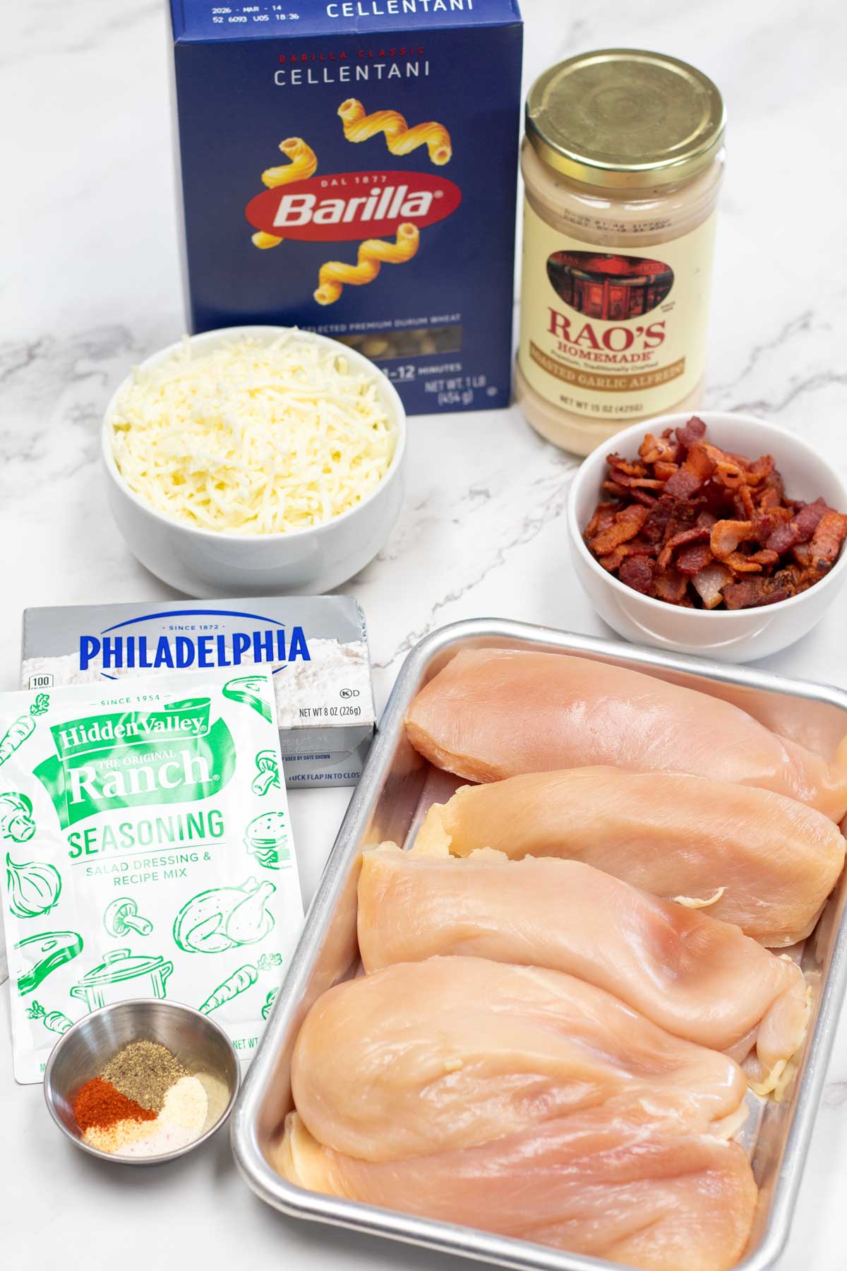 Tall image showing showing crockpot chicken bacon ranch ingredients.