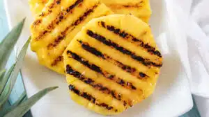 Wide image of grilled pineapple.