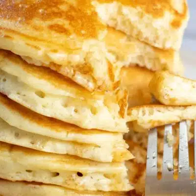 Pin image with text showing stacked pancakes.