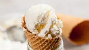 Wide image of no churn vanilla ice cream in a ice cream cone.