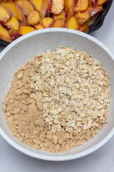 Peach crisp process photo 5 add the whole rolled oats and stir to combine.