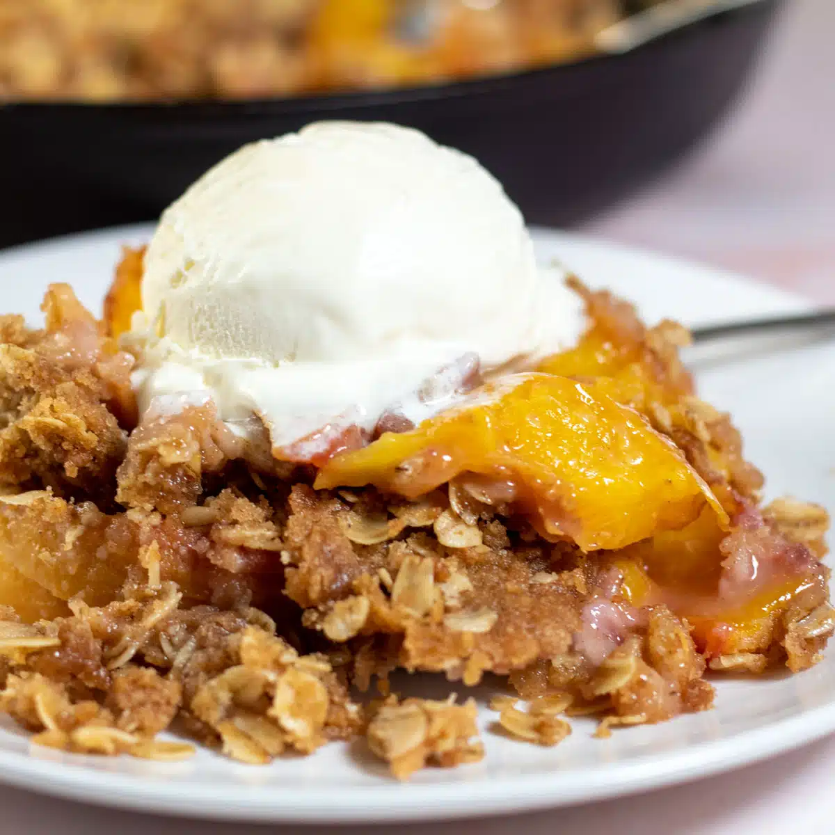 Square image of peach crisp.