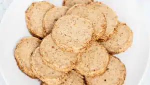 Best pecan sandies cookies recipe with baked golden cookies on a white plate for serving.