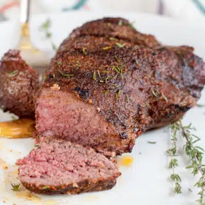 Square image of grilled ostrich steaks.