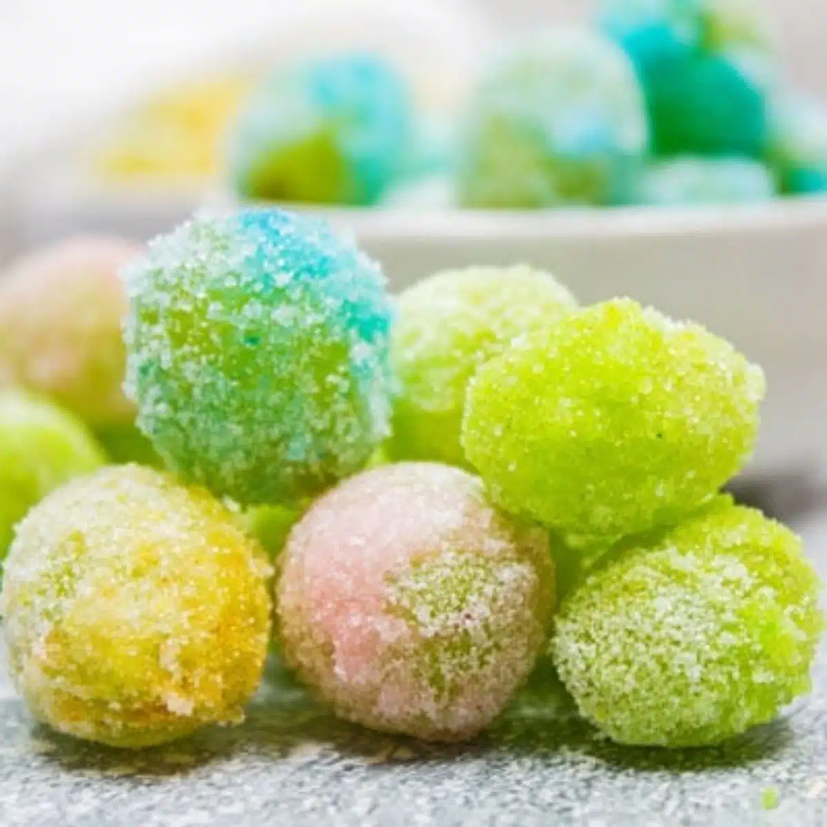Square image of colorful candy grapes.