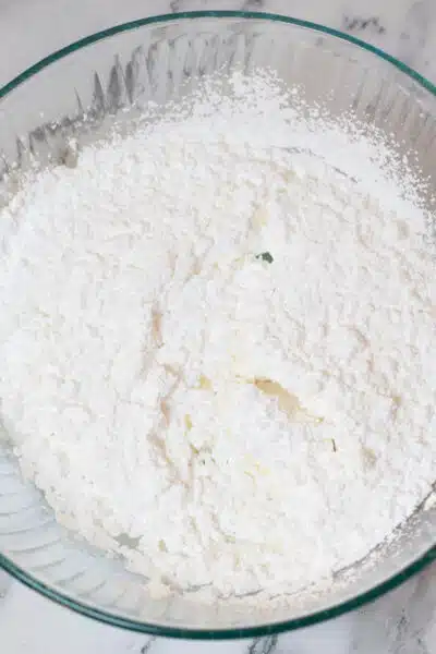 Process image 10 showing mixing together powdered sugar and meringue powder.