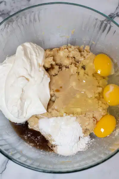 Process image 7 showing making the coffee cake batter, adding wet ingredients.