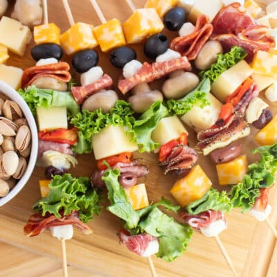 Square image of antipasto skewer appetizers.