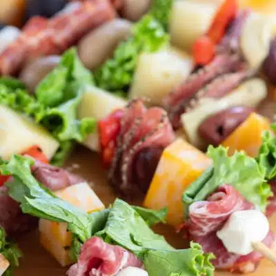Tall close up image of antipasto skewer appetizers.