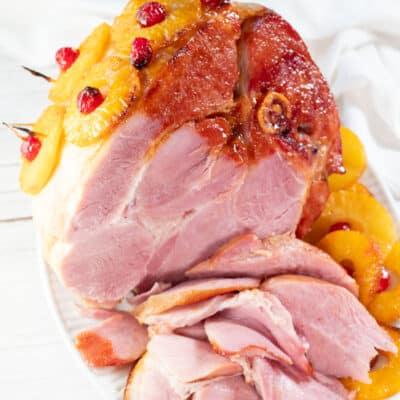 Square image of sliced baked holiday ham.