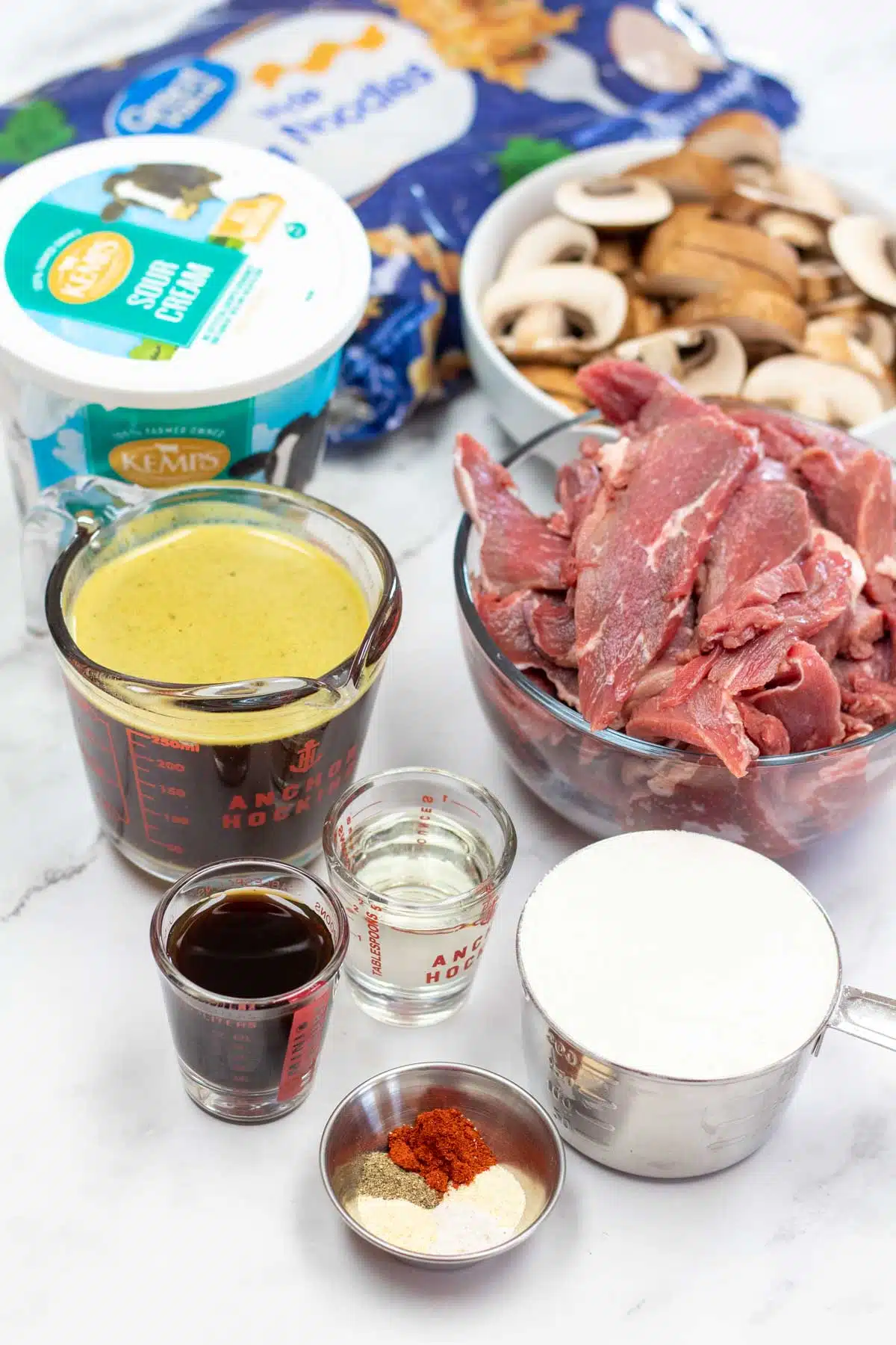 Tall image of beef stroganoff ingredients.