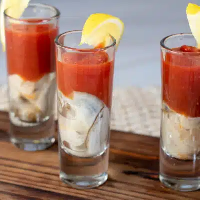 Square image of oyster shooters.