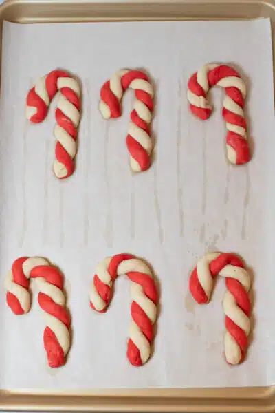Candy cane cookies process photo 10 arrange candy cane shapes on baking sheet.