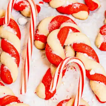 Wide image of candy cane cookies on a plate.