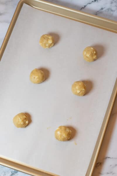 Process image 7 showing portioned cookie dough on baking sheet.