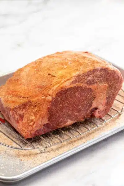 Process image 3 showing seasoned prime rib roast.