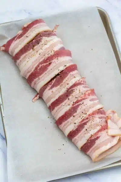 Process image 4 showing beef tenderloin wrapped in bacon.