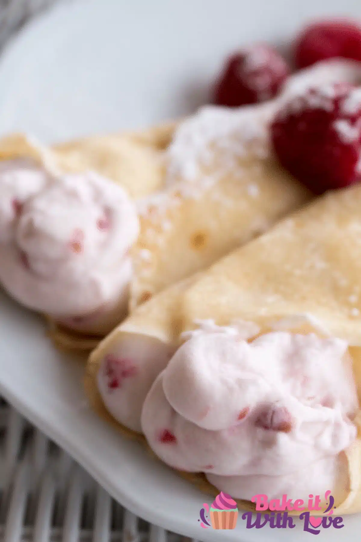 Tall image raspberry crepes.