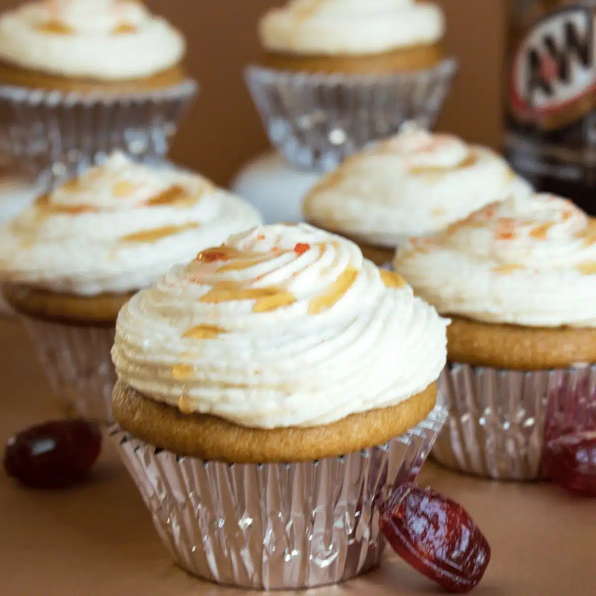 Square image of root beer cupcakes with cream soda frosting.