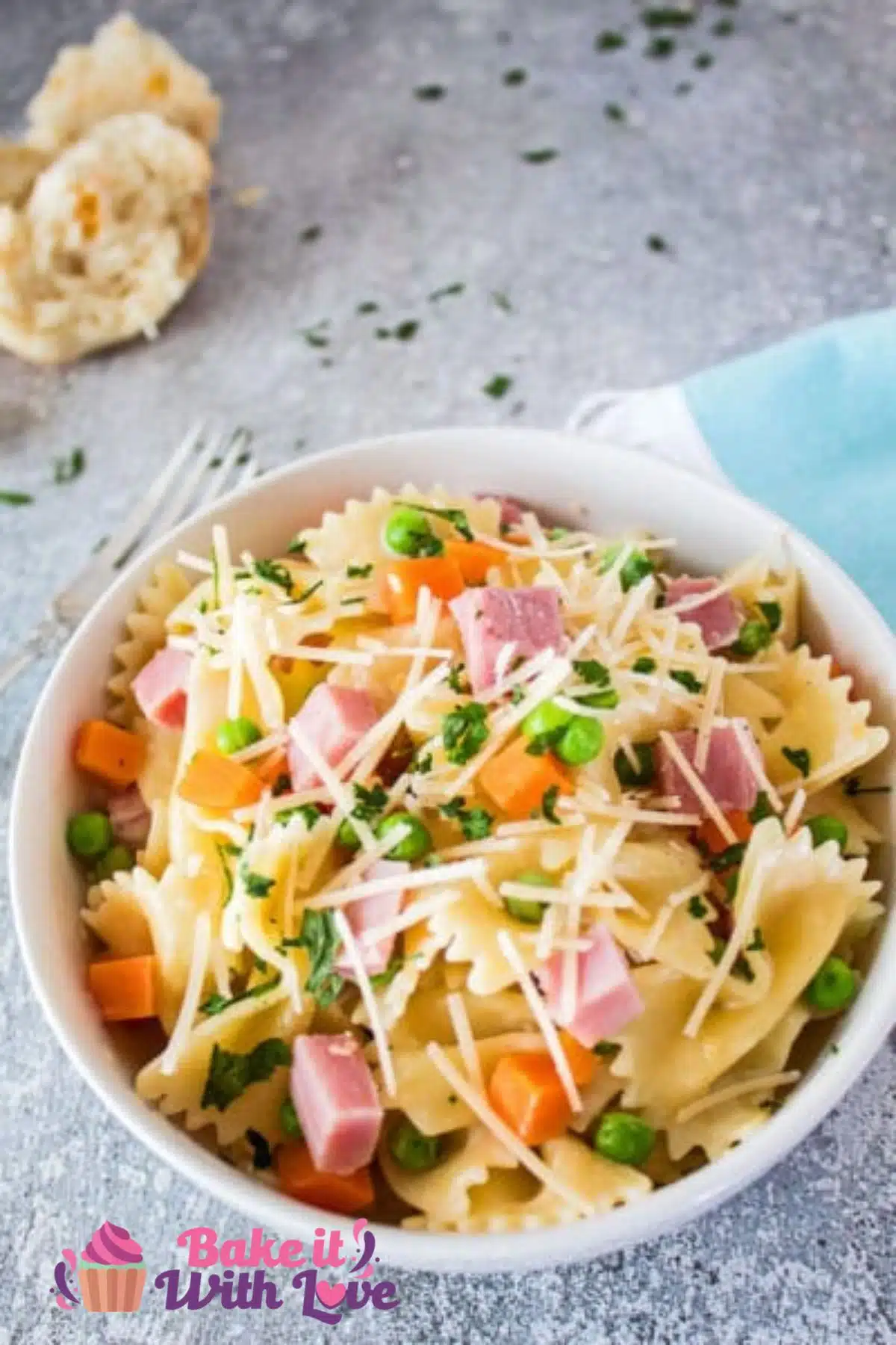 Tall image of leftover ham pasta in a bowl.