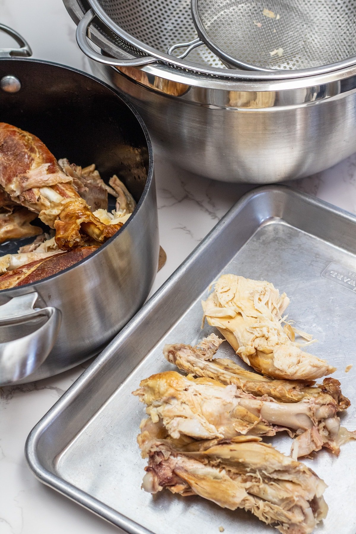 Making turkey and dumplings starting with simmering the frame or carcass to make the stock.