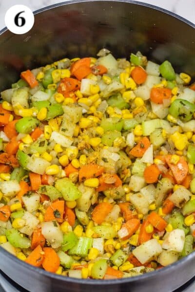 Turkey and dumplings soup process photo 6 mix seasoning into veggies and saute.