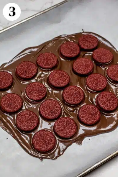 Valentine's Day Oreo chocolate bark process photo 3 arrange 20 Oreos in the melted chocolate.