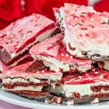 Wide closeup on the plated portions of Valentine's Day Oreo chocolate bark candy.