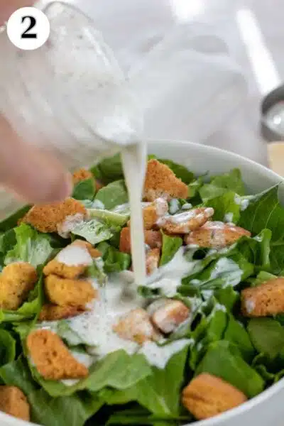 Process image 2 showing pouring dressing over a green salad.