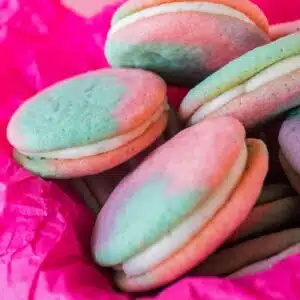 Square image of soft multi colored sugar cookies.