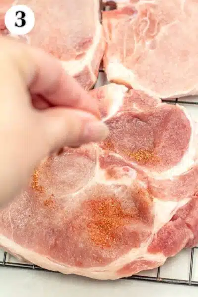 Broiled pork chops process photo 3 season on both sides.