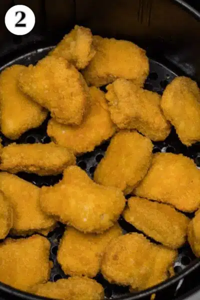 Process image 2 showing cooked nuggets in air fryer.