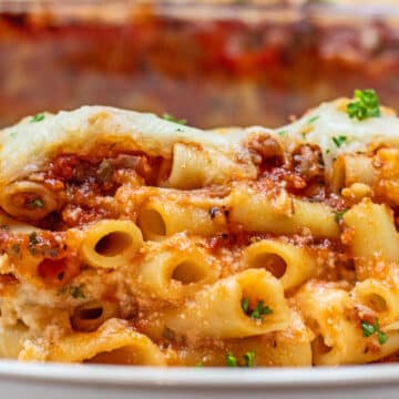 Tender pasta is combined with hearty meat sauce, ricotta, and cheese to make my baked ziti casserole dinner.