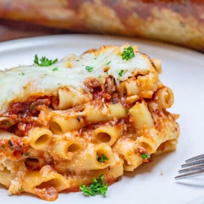 Perfectly tasty layers of meat sauce, ricotta, pasta, and cheese combine in this hearty baked ziti casserole.