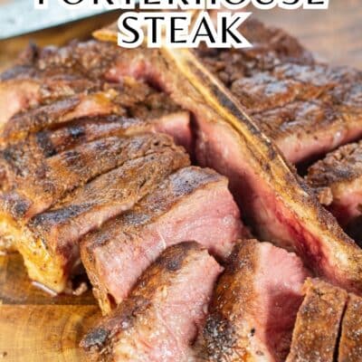 Pin image with text of a grilled Porterhouse steak on a cutting board.