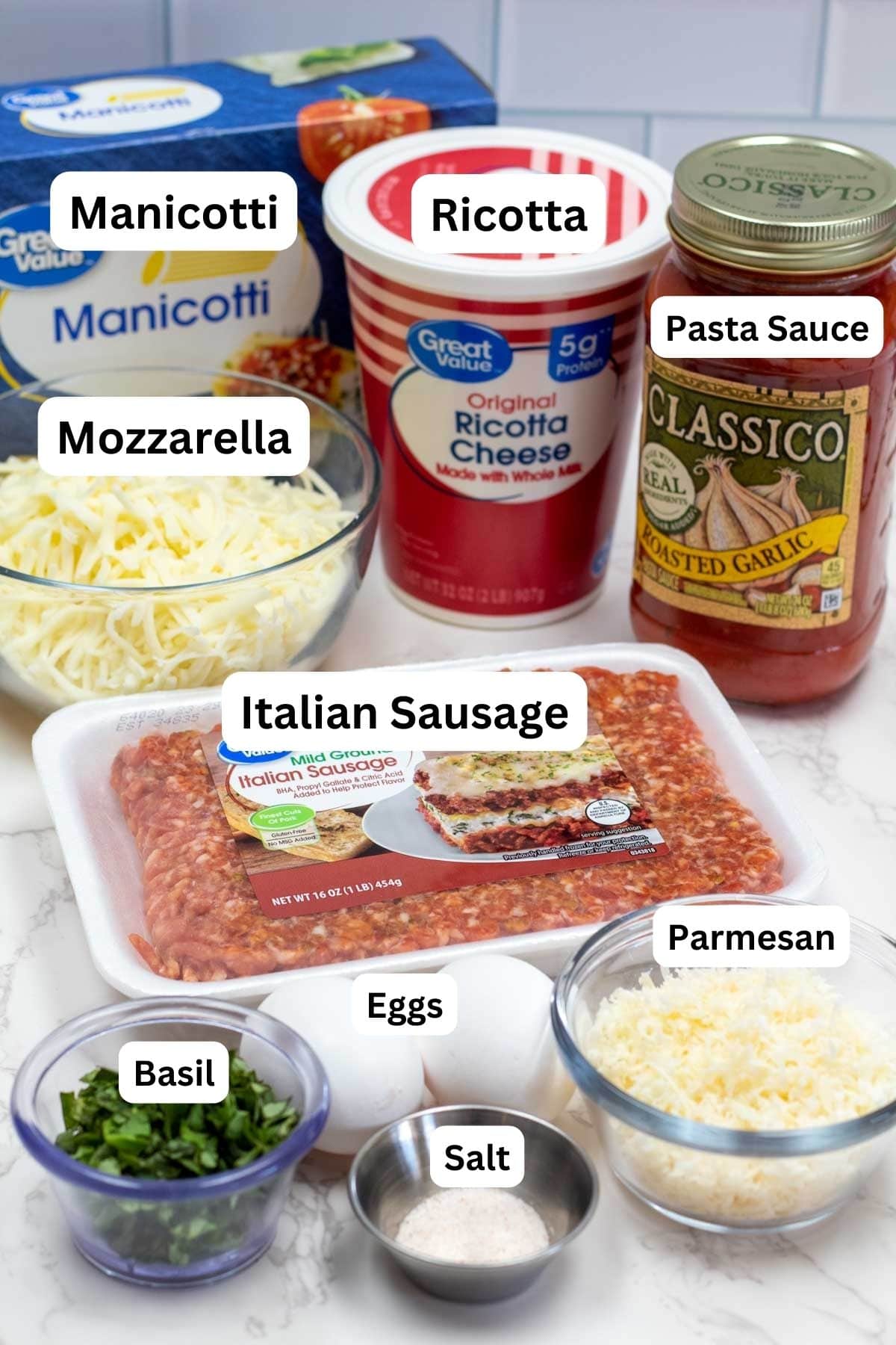 Stuffed manicotti with Italian sausage and ricotta cheese filling ingredients measured out and labeled.