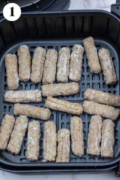 Process image 1 showing frozen sausage links in the air fryer basket.