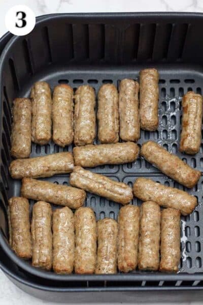 Process image 3 showing sausage links in the air fryer basket at the half way cooking point.
