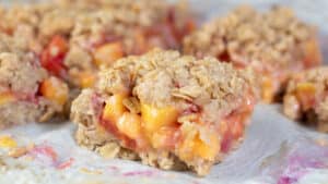 Wide image of nectarine crumble bar.