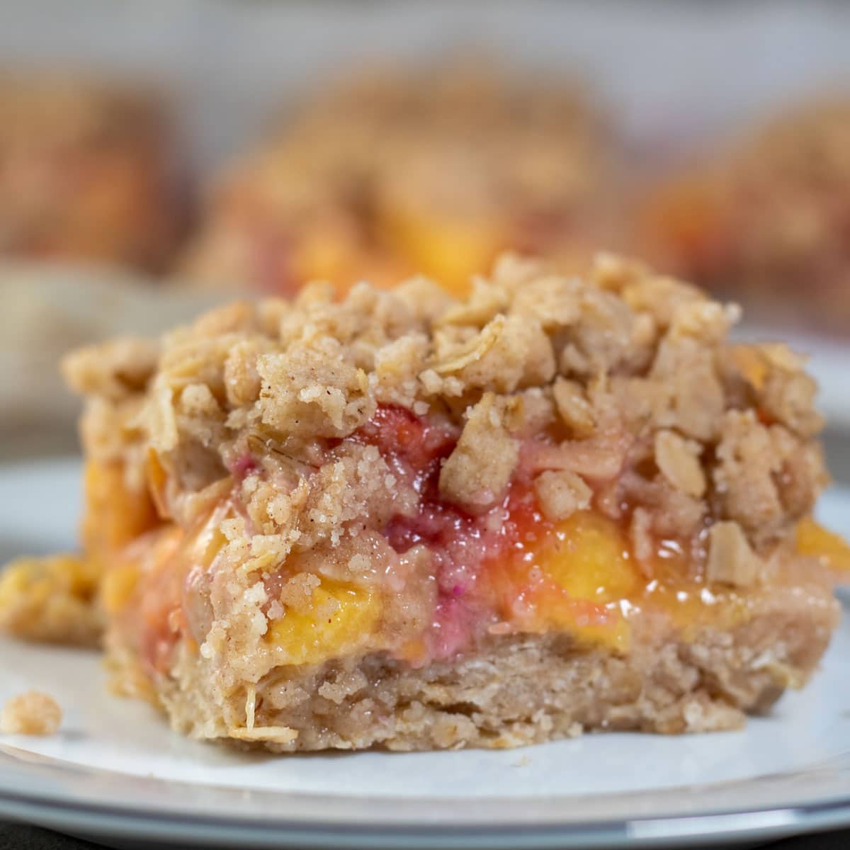 Square image of nectarine crumble bar.