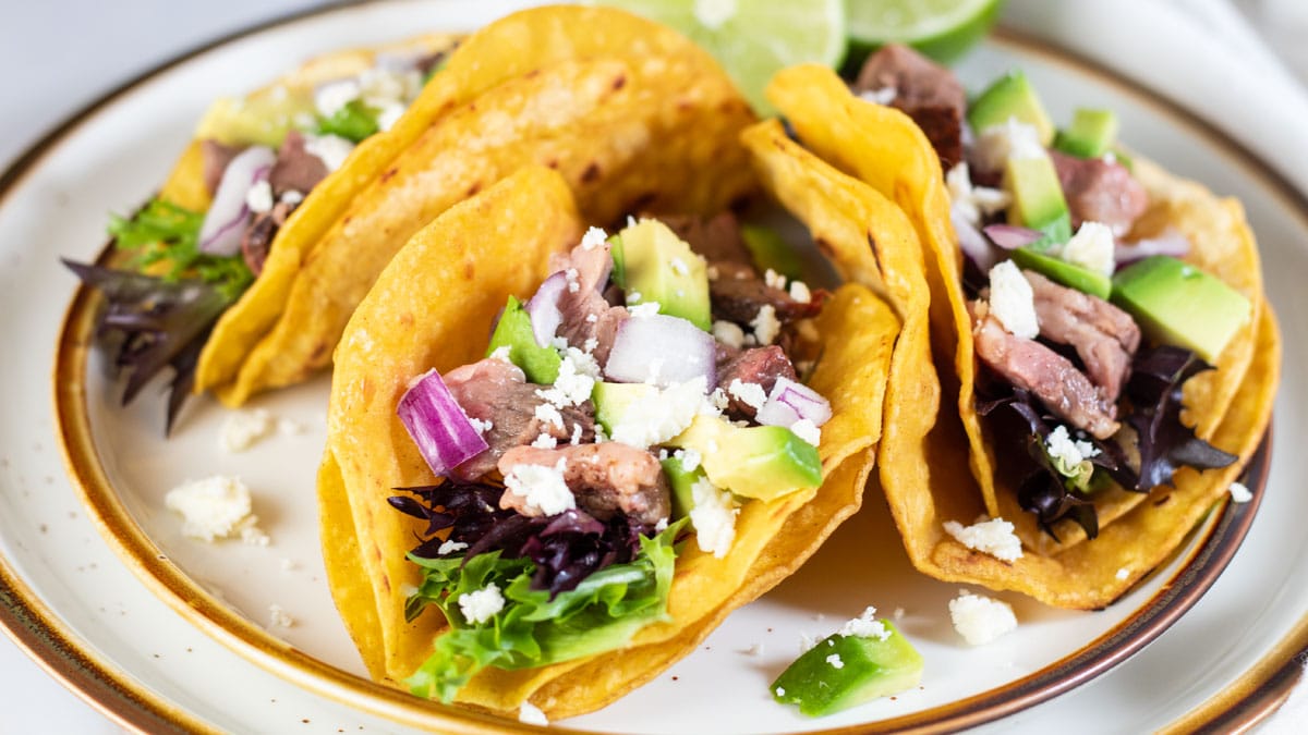 Wide image of leftover prime rib tacos.