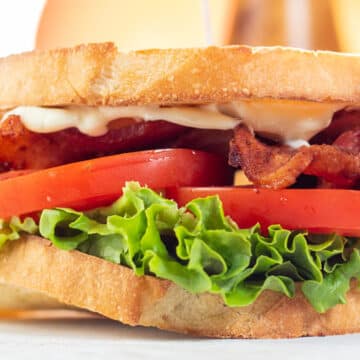 Wide image of a homemade classic BLT sandwich.